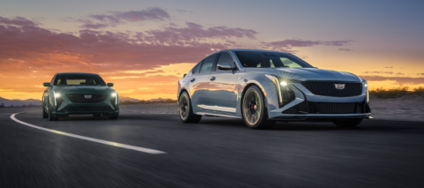 2025 Cadillac CT5-V and 2025 Cadillac CT5-V Blackwing driving at sunset.