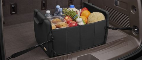 GM cargo organizer full of groceries inside a trunk