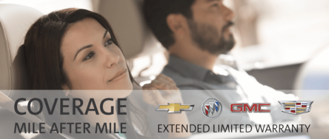 Relaxed couple driving with a text overlay “Coverage Mile After Mile, Extended Limited Warranty