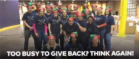 Group of GMF employees volunteering at Salvation Army with text overlay, “Too busy to give back? Think again!”
